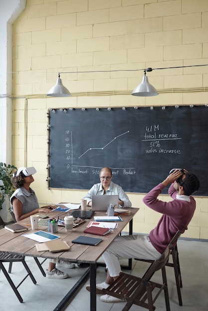 Accountant at desk reviewing financial documents thoughtfully